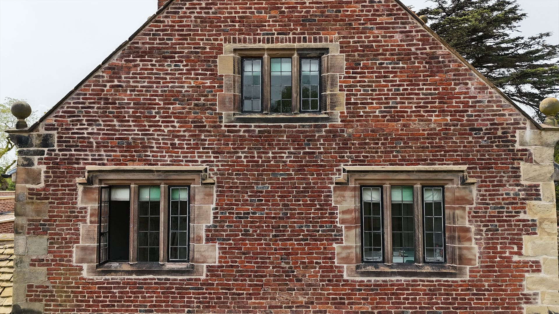Lyons Stonework crafting custom stone features for bespoke luxury homes, including facades, walls, and detailed masonry.