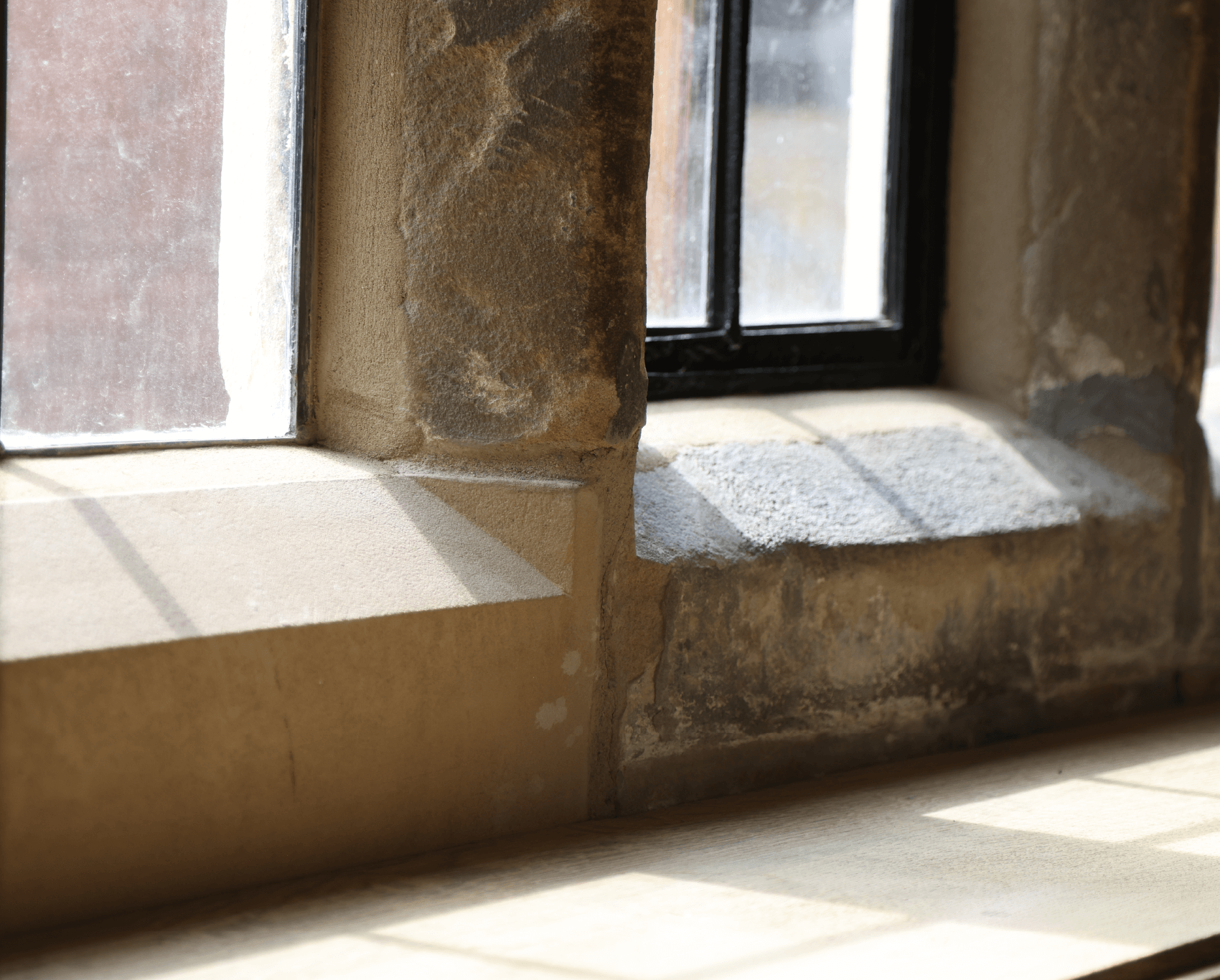 Lyons Stonework repairing stone window frames, restoring both structural integrity and architectural beauty.